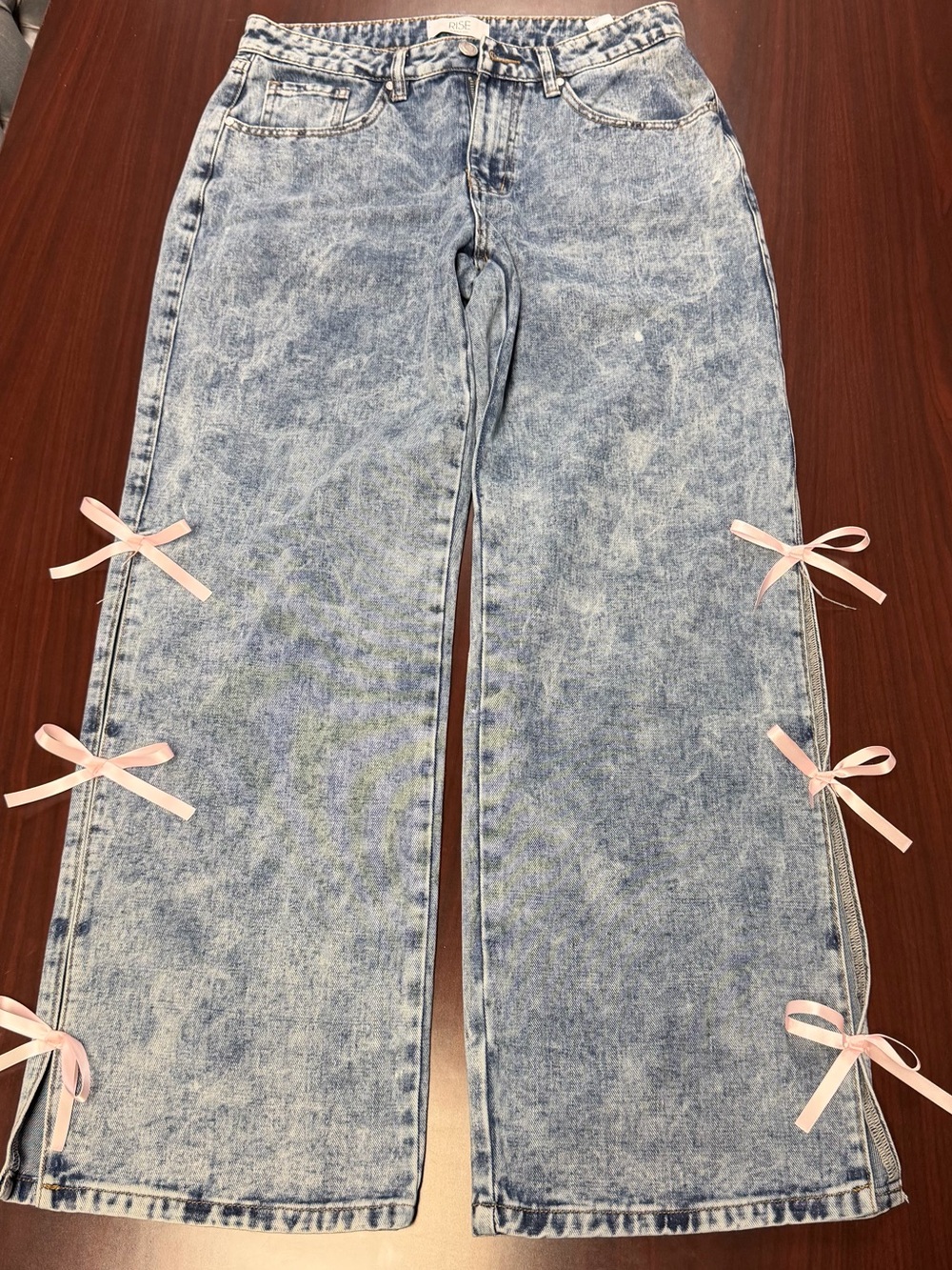 Women’s Light Blue Acid Wash Jeans with Pink Bow Details